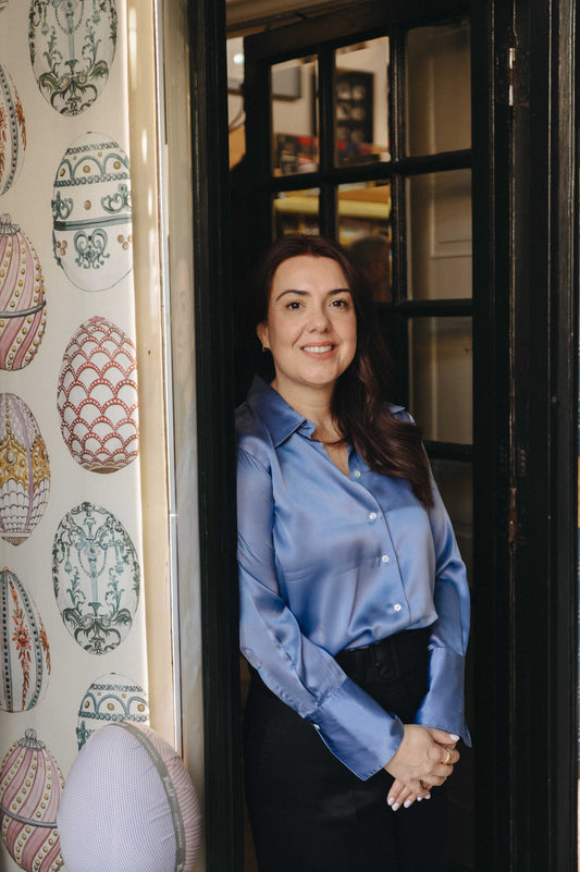 Lizandra Bespoke Cutter in doorway of the Budd Shop