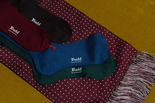 Silk Blend Socks laid on red spotted silk scarf