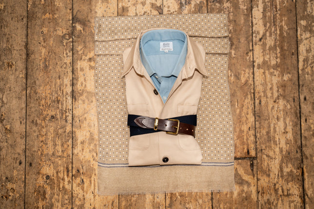 Beige overshirt jacket with blue shirt laid out