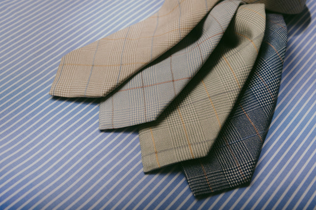 Prince of wales check ties on stripe blue background