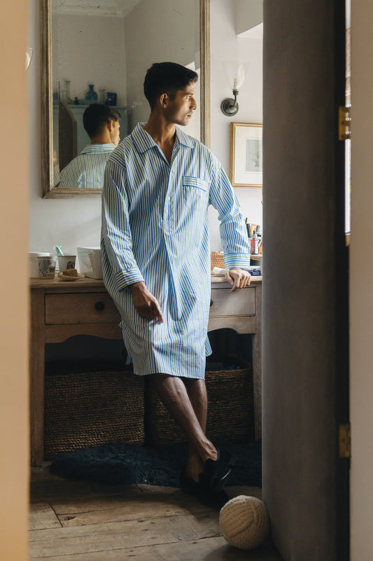 Model wearing blue stripe nightshirt in bathroom