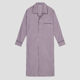 A long-sleeve button-front nightshirt or pajama shirt with vertical purple and white stripes, featuring a pointed collar, button placket, and a chest pocket with striped piping, shown on a light gray background.