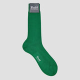 A single dark green crew sock with a gray 'Budd Shirtmakers' brand tag at the top and white 'Budd' branding on the side, shown against a solid light gray background.