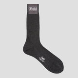 A single dark charcoal gray ribbed crew sock with a gray brand label at the cuff and white printed branding near the toe, shown on a light gray background.