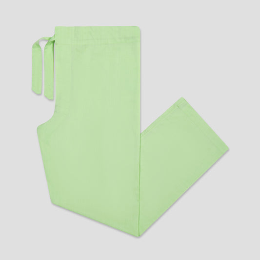 Light green pyjama bottoms on a light gray background