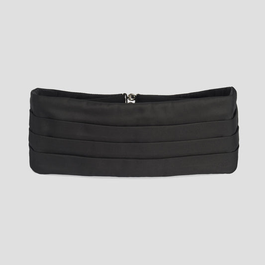 Black cummerbund on plain grey background