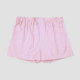 Pink and white vertically striped cotton shorts with an elastic waistband, shown flat against a light gray background.
