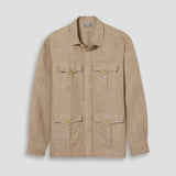 Beige linen safari shirt on plain pale grey background