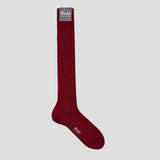 Luxurious claret red long socks in soft cashmere blend with ribbed texture and reinforced heel for superior comfort.