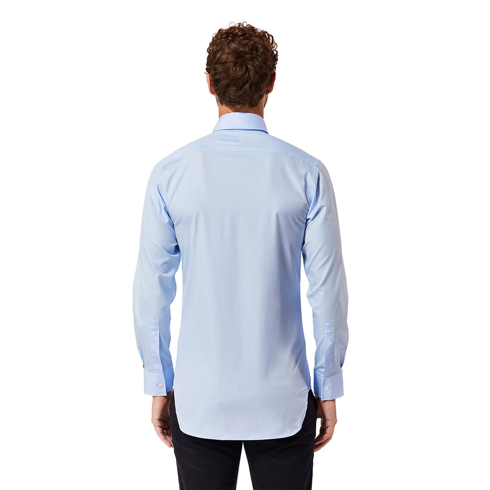 Man stood with back facing the camera wearing a blue shirt