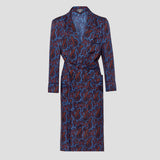 A long-sleeve silk dressing gown with a waist tie, featuring an all-over paisley pattern in navy blue, burgundy red, and bright blue on a light gray background.