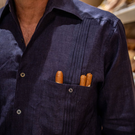 Navy blue shirt with three cigars in the pocket