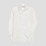 A white long-sleeve Guayabera shirt with button-down cuffs and a spread collar, displayed on a neutral light gray background.