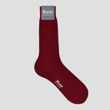 Maroon sock with 'Budd' branding on a pale grey plain  background