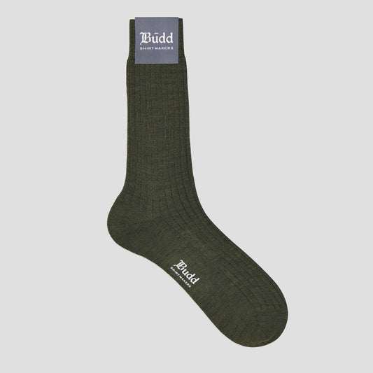 Olive green short sock on a pale grey background