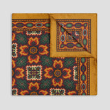 Paisley Mosaic Silk Pocket Square in Amber folded on plain grey background