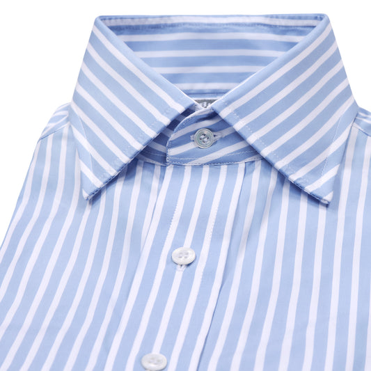 Close-up of a light blue and white vertically striped dress shirt collar and upper front with white buttons on a plain white background.