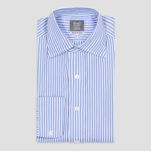 A folded long-sleeve dress shirt with vertical blue and white stripes, featuring a pointed collar, white buttons, and a brand label reading 'Budd' on a light gray background.