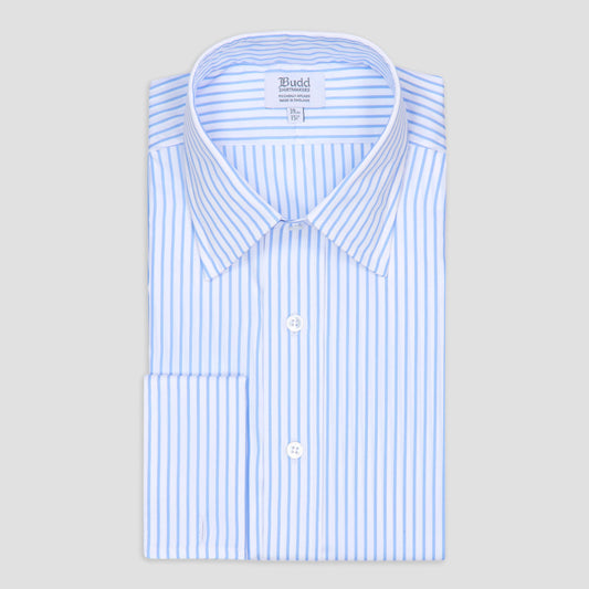 A folded long-sleeve dress shirt with light blue and white vertical stripes, featuring a pointed collar, white buttons, and a visible Budd neck label, set against a solid light gray background.