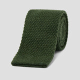 Luxurious loden green knitted tie crafted from soft, textured pure cashmere for a sophisticated, modern look.