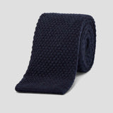 Luxurious navy blue knitted tie crafted from soft, textured pure cashmere with a classic flat-end design.