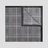 Black and white Prince of Wales check silk twill pocket square, 43cm x 43cm, featuring a refined hand-rolled black border.