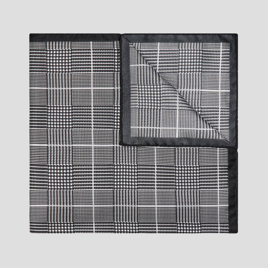 Black and white Prince of Wales check silk twill pocket square, 43cm x 43cm, featuring a refined hand-rolled black border.