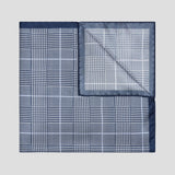 Navy and white Prince of Wales check silk twill pocket square with a sky blue overcheck, 43cm square, made in England.