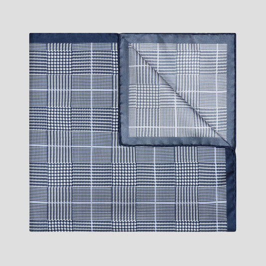 Navy and white Prince of Wales check silk twill pocket square with a sky blue overcheck, 43cm square, made in England.
