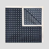 Navy and ivory polka dot silk twill pocket square with an elegant contrast border, screen printed in England.