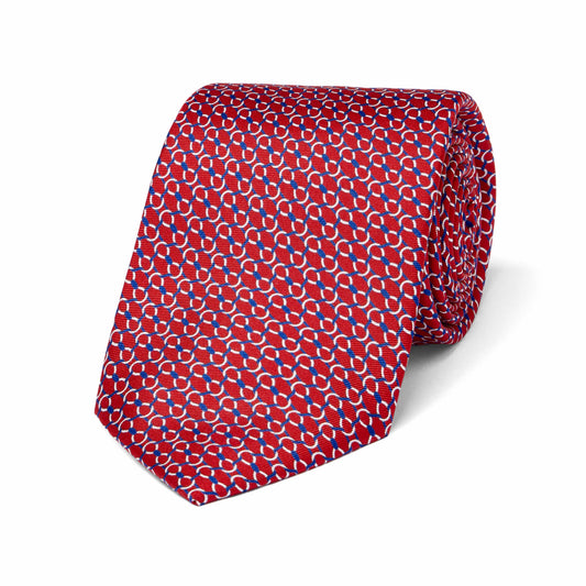Red tie with a geometric pattern on a white background