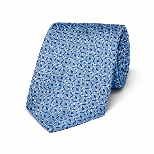 Blue patterned tie on a white background