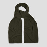 An olive green ribbed knit scarf, styled in a loop knot, displayed against a solid light gray background.