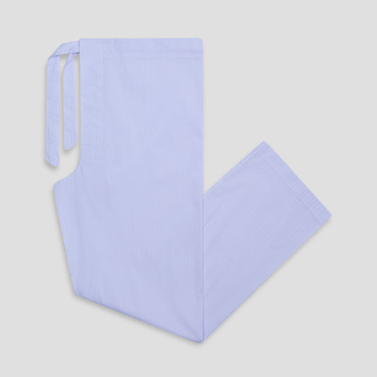 A light lavender hospital scrub apron with a front tie closure, laid flat on a neutral light gray background.