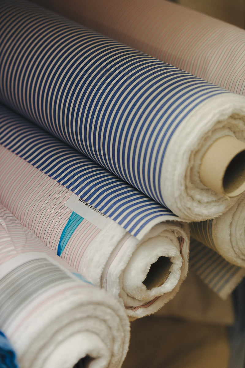 Rolls of shirt cloths at cutting workshop