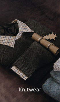 Knitwear with plaid accents on a dark background
