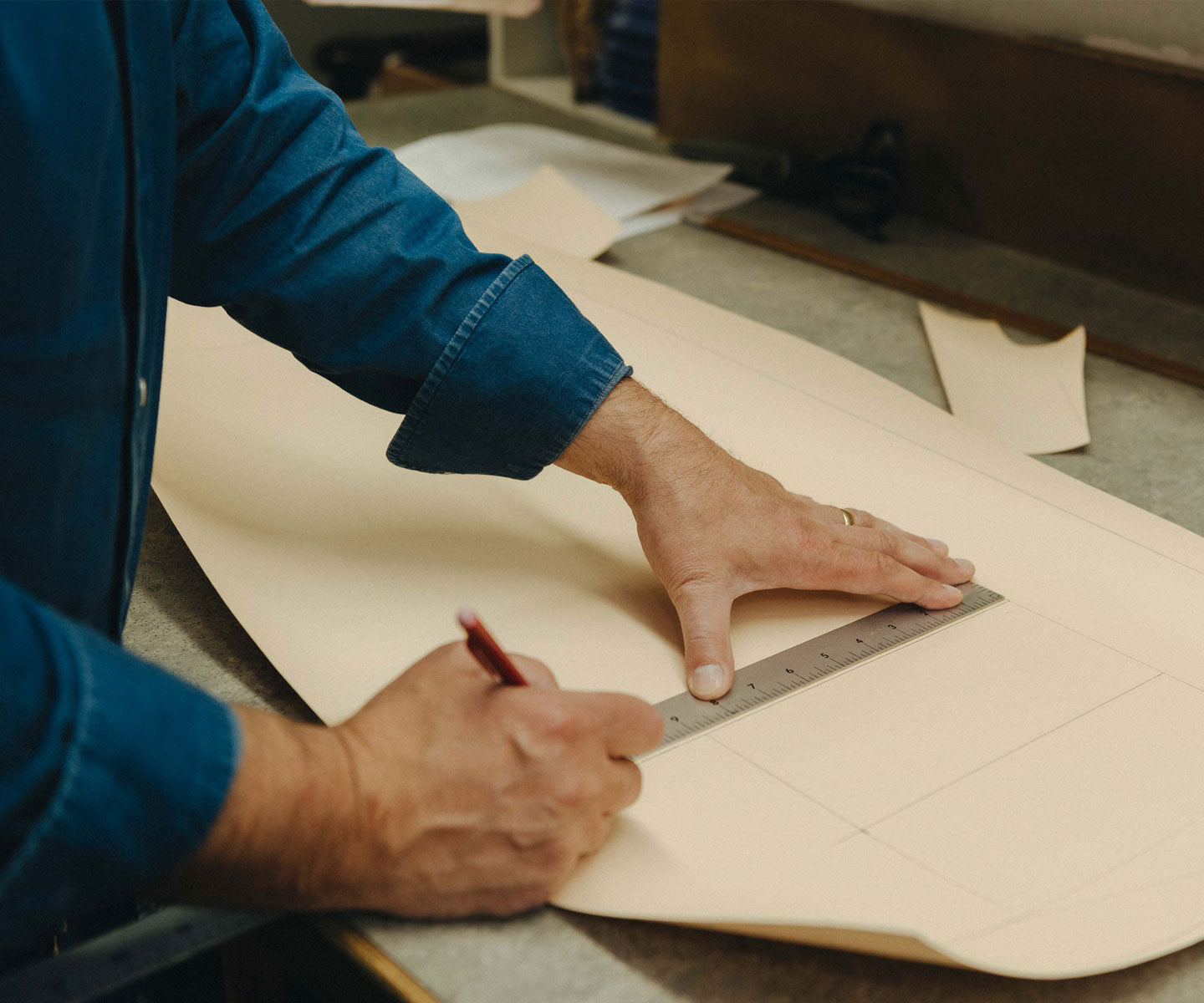 Made to measure wedding, shirt pattern being measured out