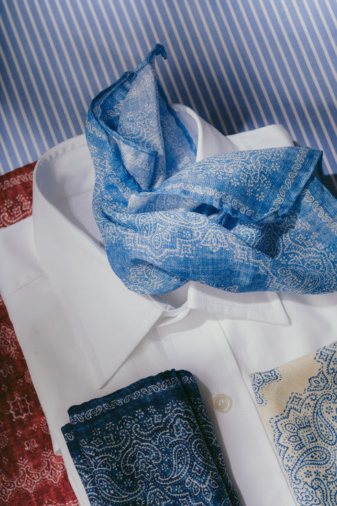 Printed pattern pocket squares laid on white shirt