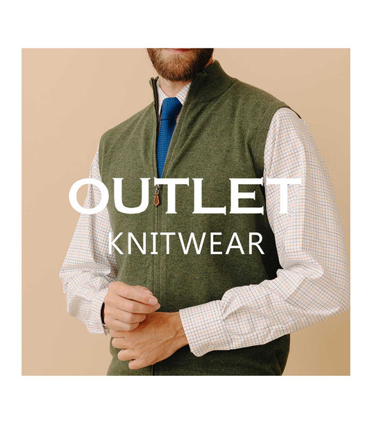 Man wearing green knitted gilet with Outlet Knitwear written across the image
