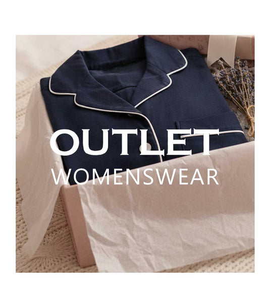 Navy blue pajama set with white trim on a beige surface, labeled 'Outlet Women'swear'.