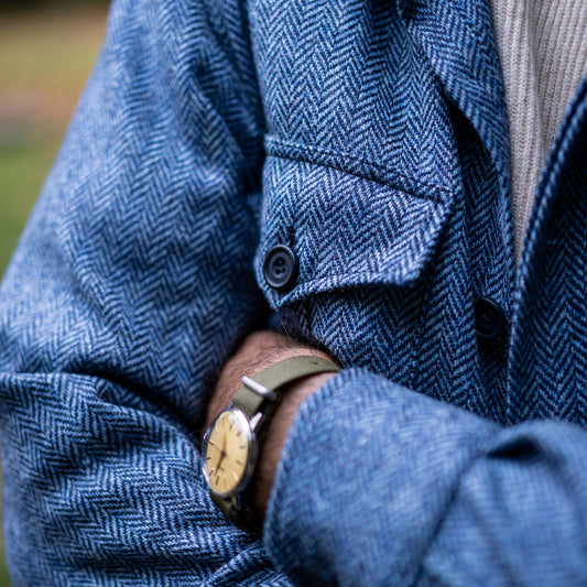 Herringbone Wool Button Cuff Safari Shirt in Blue on model pockets